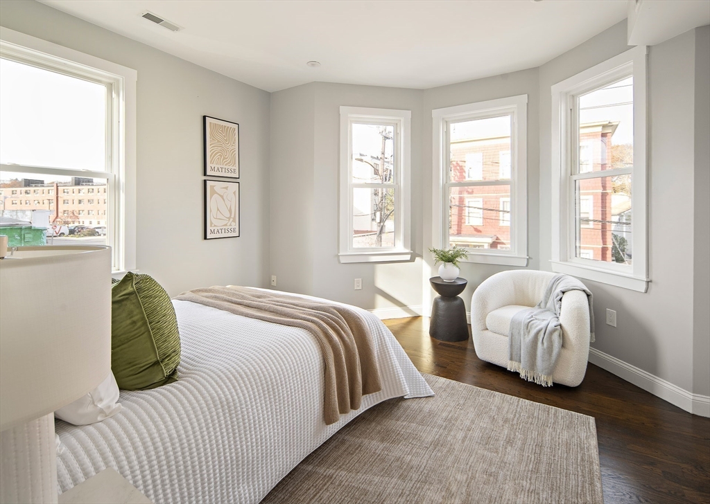 9-11 Boynton Street, Unit 2 Boston, MA 02130 - Photo 10 of 30 a bedroom with two beds and a large window