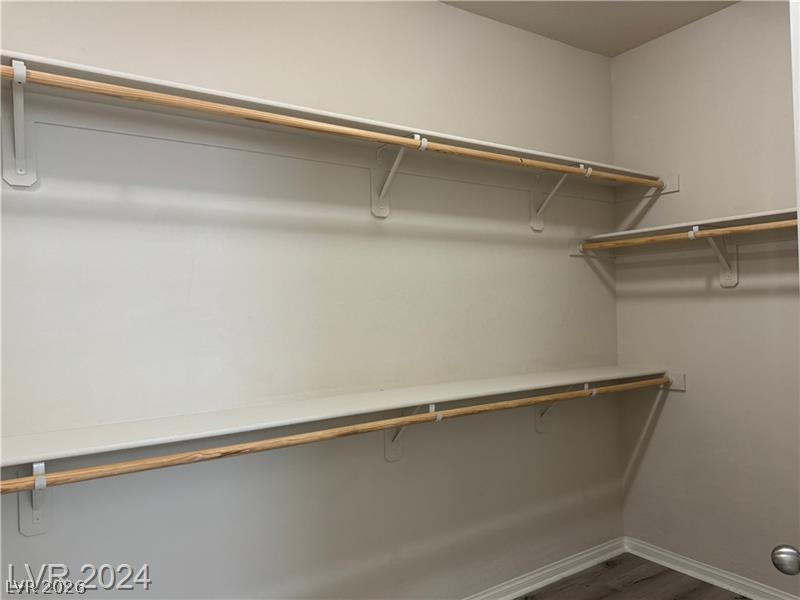 9056 Tony Ridge Avenue Las Vegas, NV 89148 - Photo 20 of 32 Ample shelving and hanging space offer organized storage in this well-appointed closet.