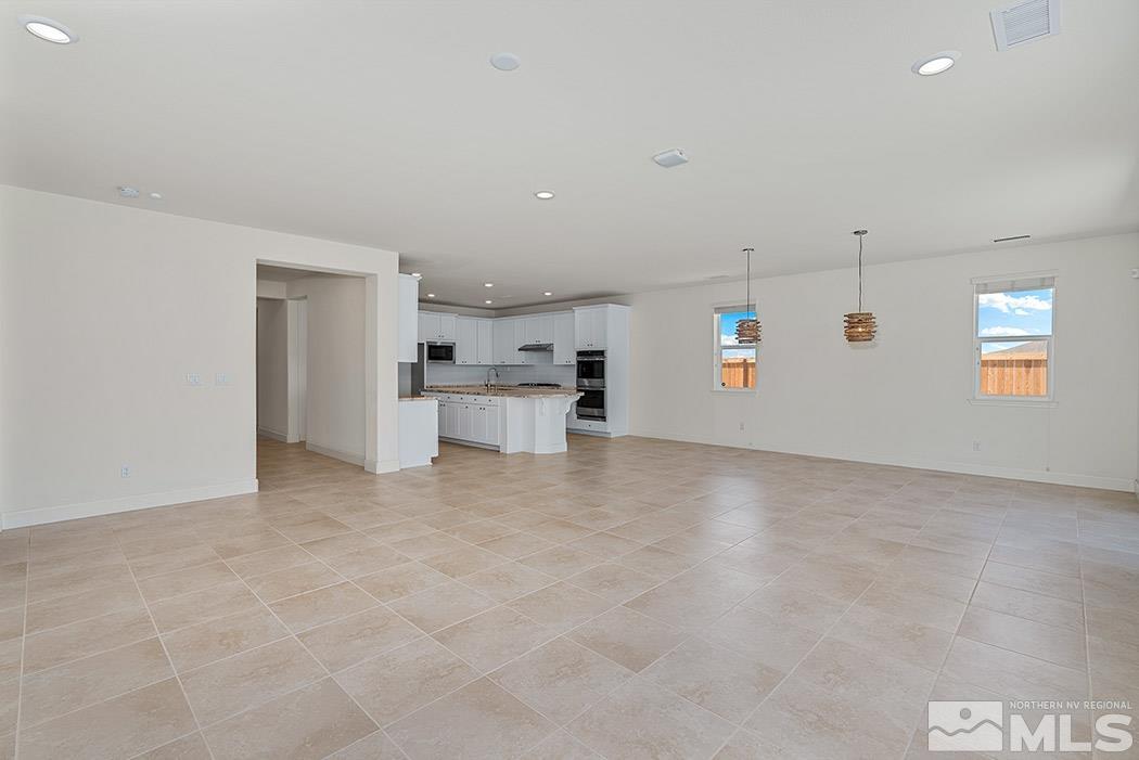 10410 Palladium Mine Drive Reno, NV 89521 - Photo 13 of 26 a view of a kitchen with furniture and a refrigerator