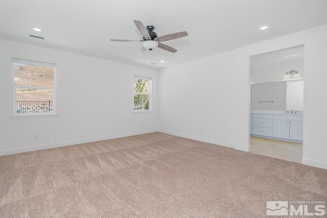 10410 Palladium Mine Drive Reno, NV 89521 - Photo 18 of 26 wooden floor in an empty room and a window