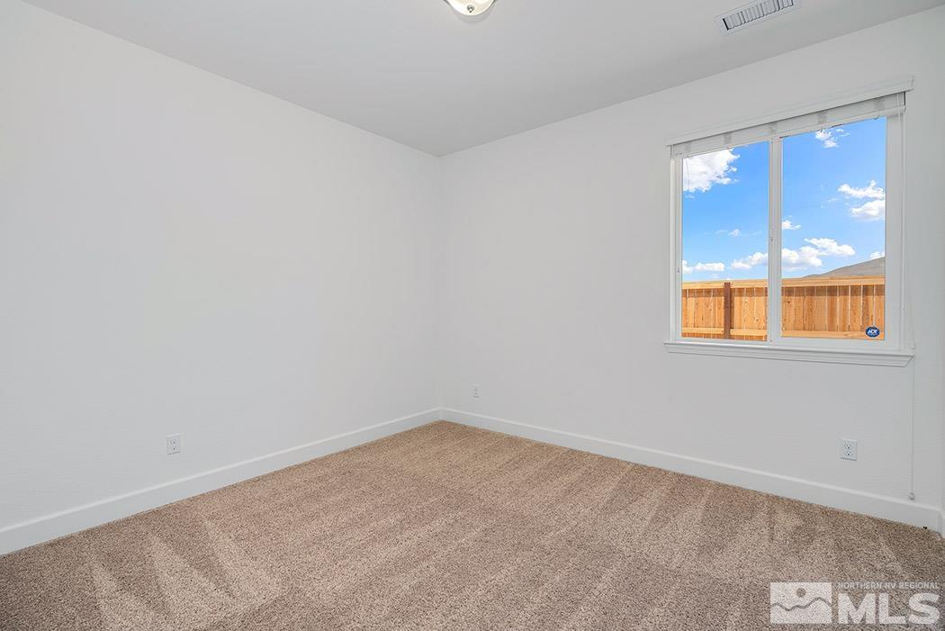 10410 Palladium Mine Drive Reno, NV 89521 - Photo 21 of 26 an empty room with a window