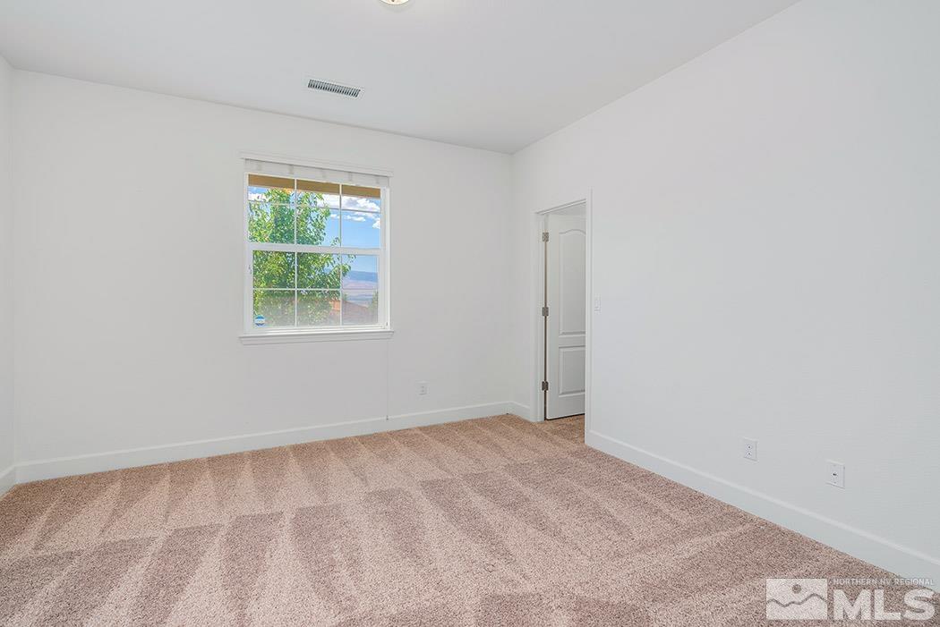 10410 Palladium Mine Drive Reno, NV 89521 - Photo 22 of 26 an empty room with a window