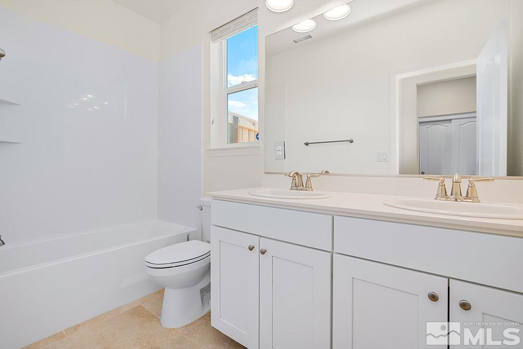 10410 Palladium Mine Drive Reno, NV 89521 - Photo 23 of 26 a bathroom with a sink toilet and shower