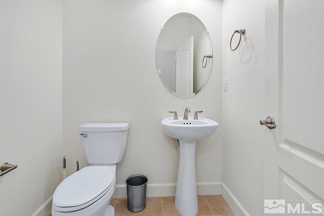 10410 Palladium Mine Drive Reno, NV 89521 - Photo 26 of 26 a bathroom with a sink toilet and a mirror