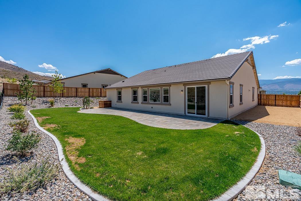 10410 Palladium Mine Drive Reno, NV 89521 - Photo 7 of 26 a view of a house with a backyard porch and sitting area