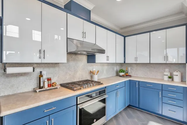 a kitchen with cabinets appliances cabinets and a sink