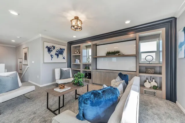 a living room with furniture and a table