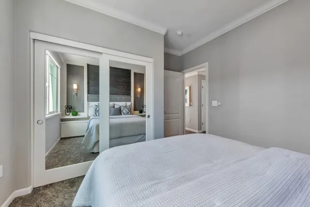 a bedroom with a bed and a table