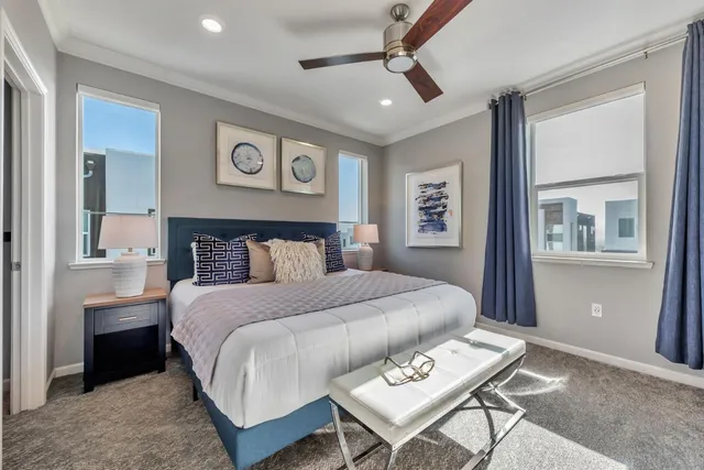 a bedroom with a large bed and a dresser