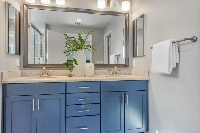 a front view of a building with plants