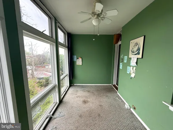 a view of a hallway with windows