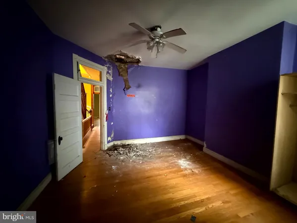 a view of room with a ceiling fan and window