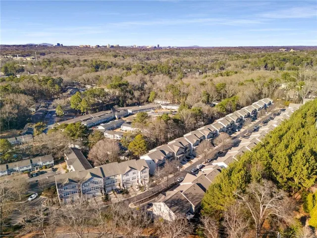 an aerial view of a house with swimming pool and outdoor space