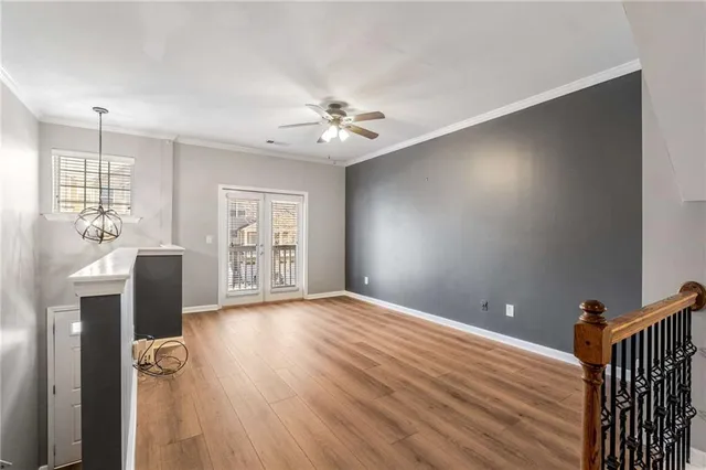 a view of livingroom with hardwood floor and a ceiling fan