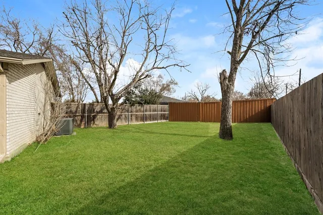 a backyard of a house with lots of green space