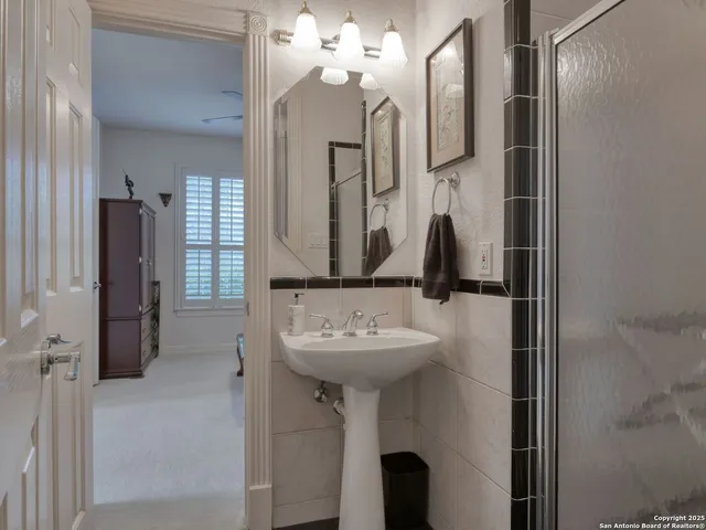 a kitchen with stainless steel appliances kitchen island granite countertop a table and chairs in it