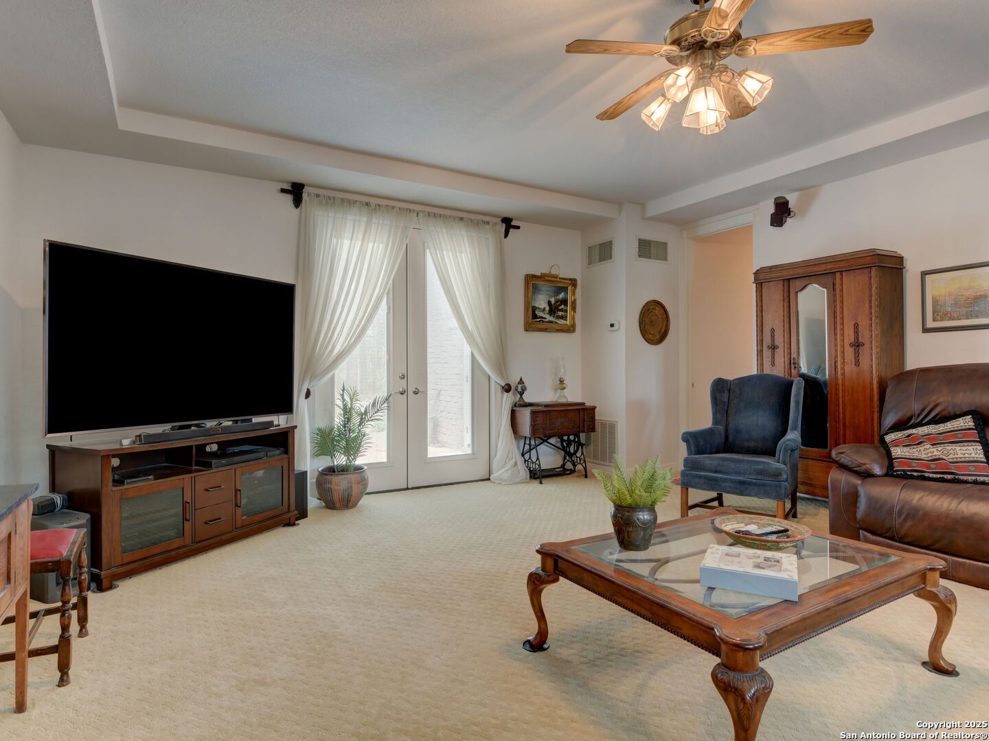 109 A Ammann Road Boerne, TX 78015 - Photo 21 of 67 a living room with furniture and a flat screen tv