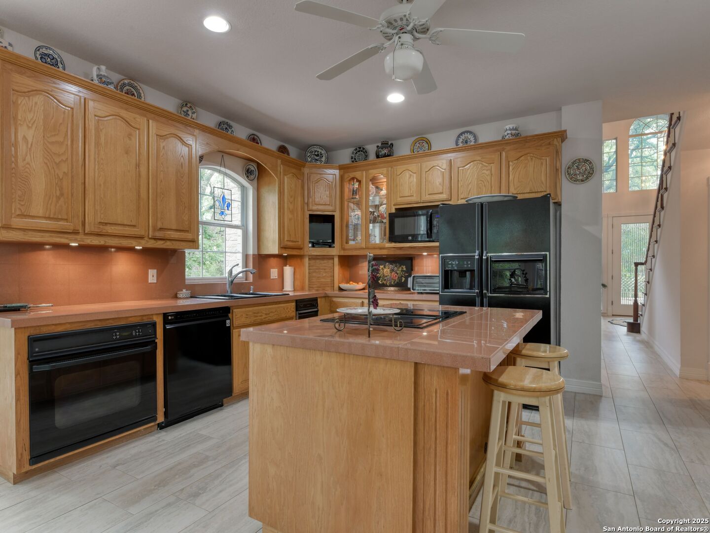 109 A Ammann Road Boerne, TX 78015 - Photo 24 of 67 a kitchen with a stove a sink and a refrigerator