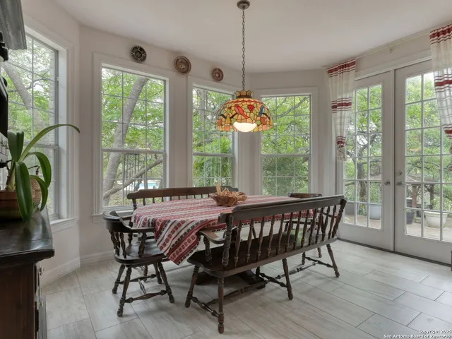 a bath tub sitting in a bathroom next to a window