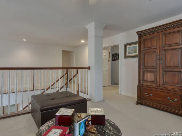 a bedroom with a bed and a table lamp
