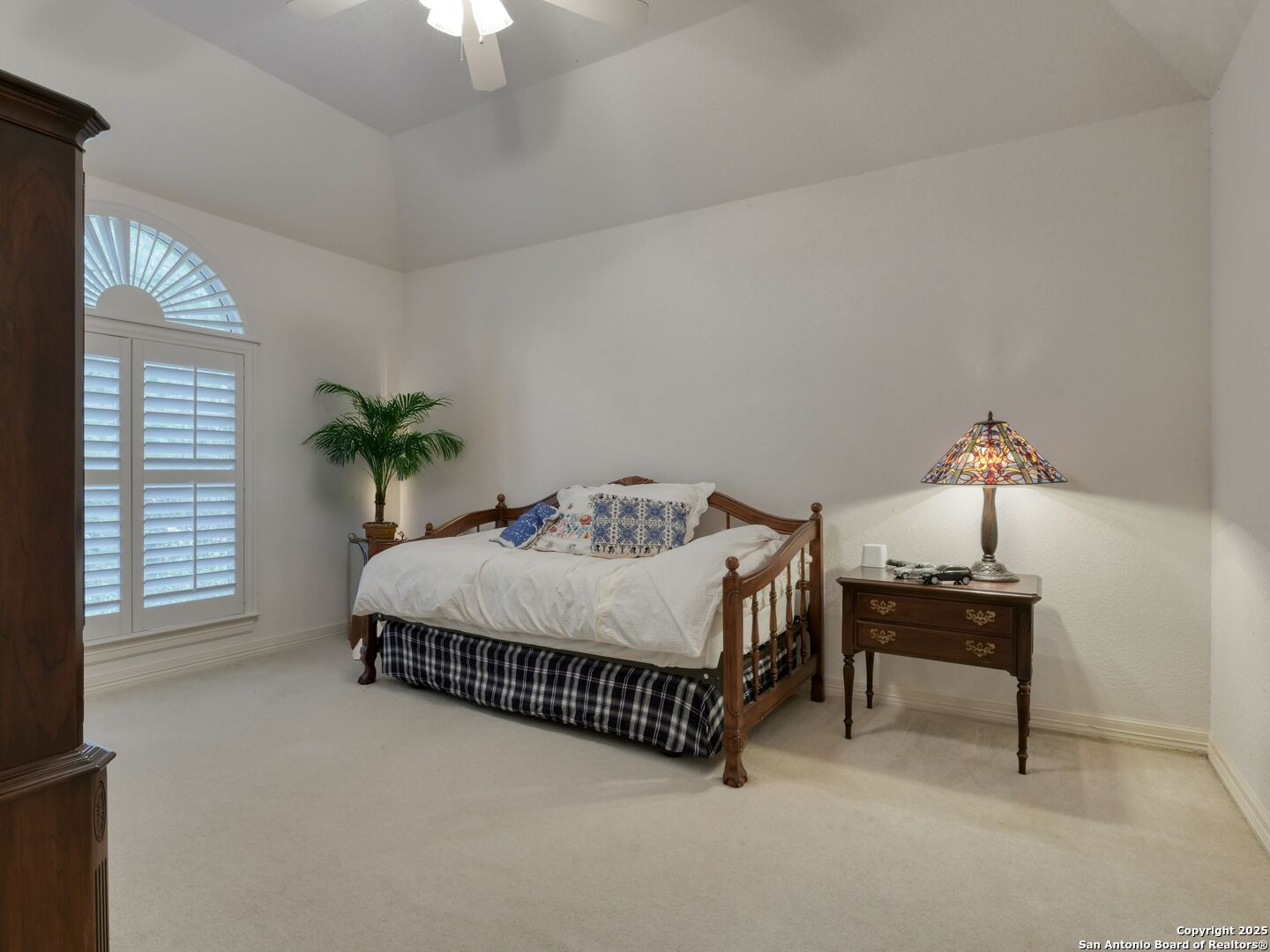 109 A Ammann Road Boerne, TX 78015 - Photo 38 of 67 a bedroom with a bed and a table lamp