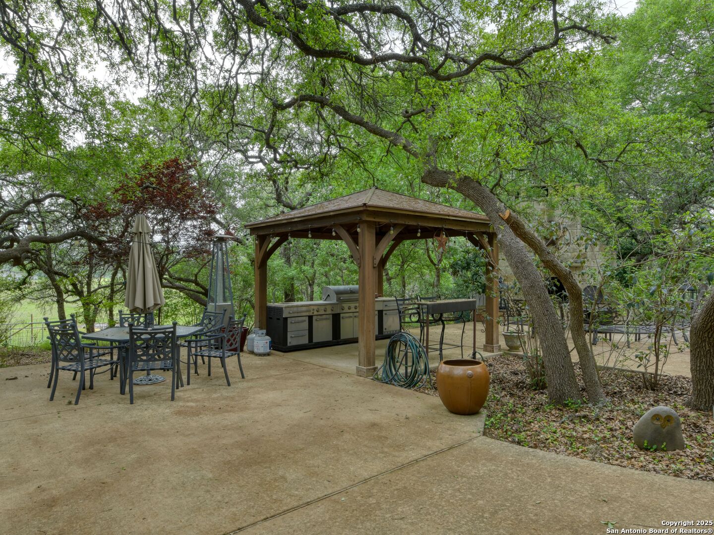 109 A Ammann Road Boerne, TX 78015 - Photo 60 of 67 a view of backyard with outdoor seating and trees