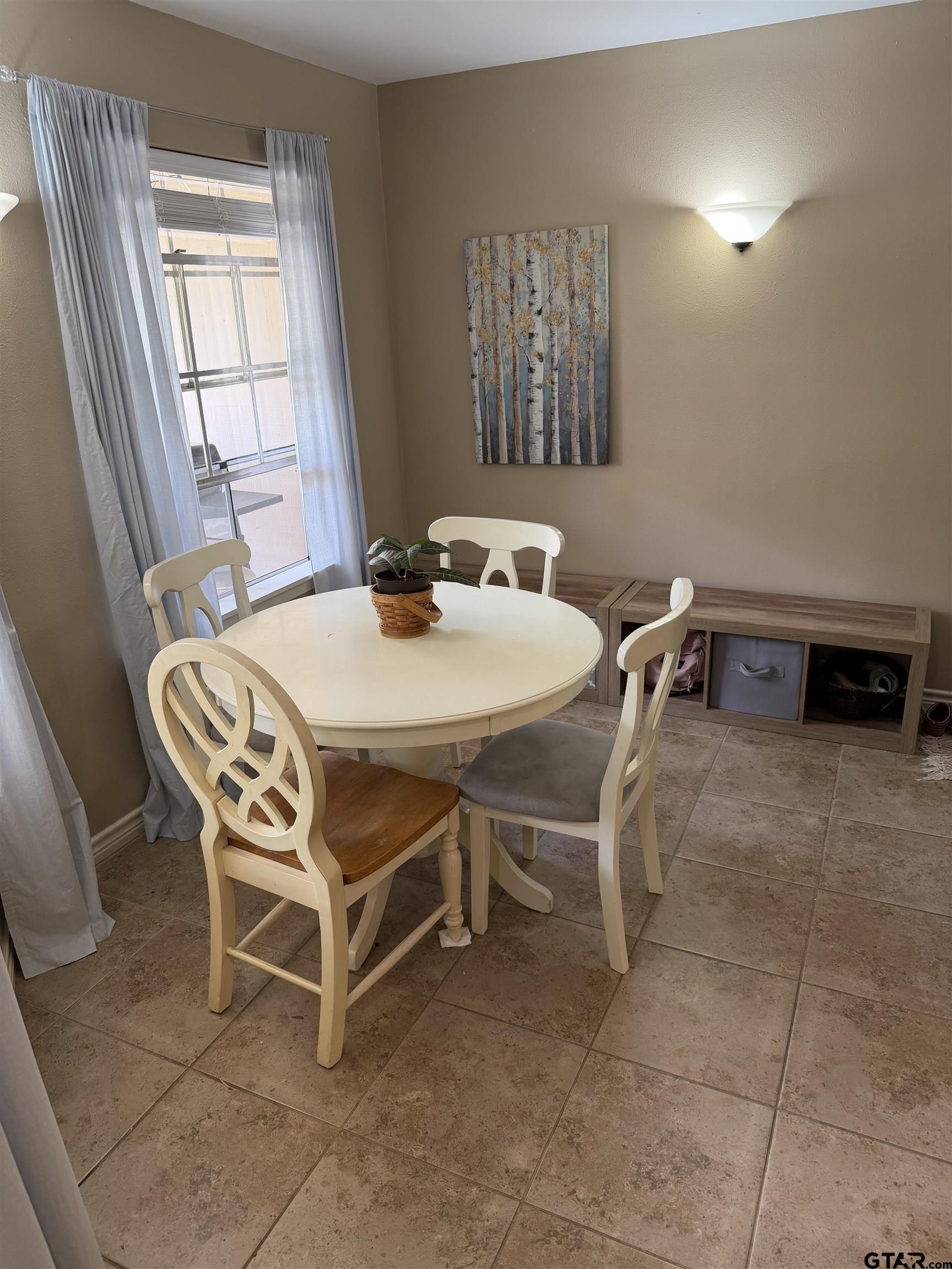 5704 Foxcroft Road Tyler, TX 75703 - Photo 6 of 10 a dining room with furniture and window