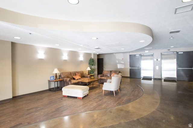 2150 South Main Street, Unit R405 Salt Lake City, UT 84115 - Photo 2 of 20 Lobby area featuring mixed wood-finish and polished concrete flooring, recessed lighting, and curved ceiling architectural details