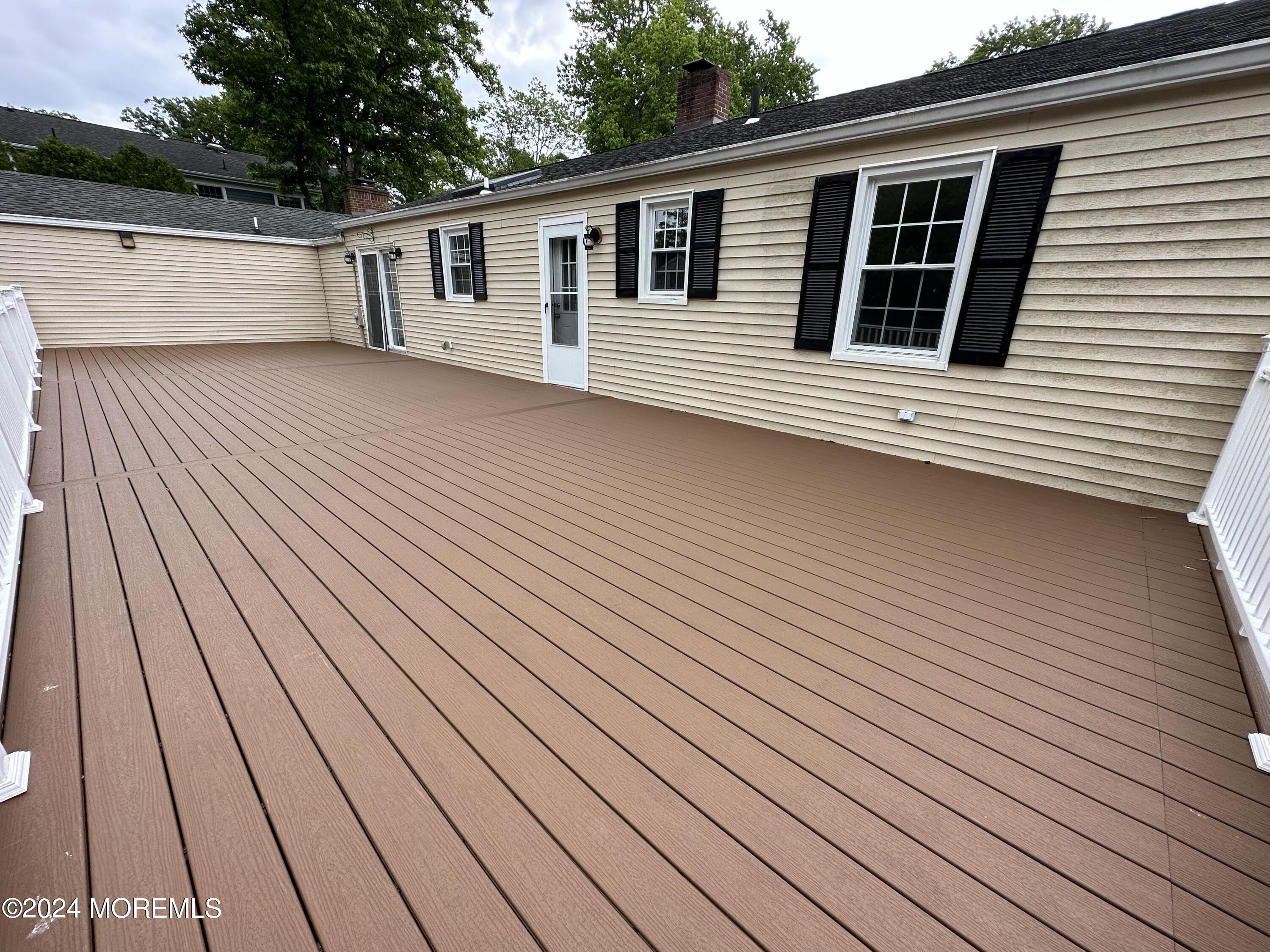 57 Kings Road Little Silver, NJ 07739 - Photo 21 of 22 a view of a house with wooden deck