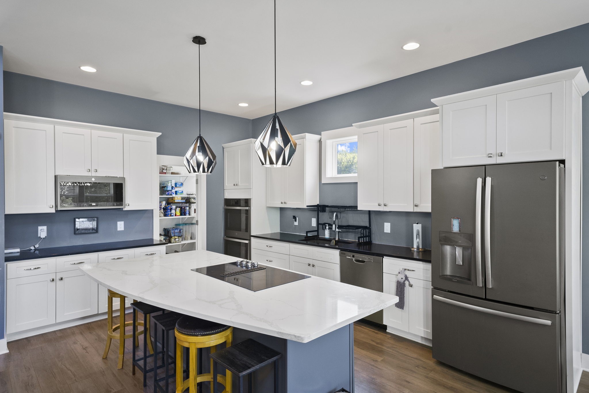 4217 Sandy Springs Road Springfield, TN 37172 - Photo 21 of 50 a kitchen with stainless steel appliances a sink a stove a refrigerator and island
