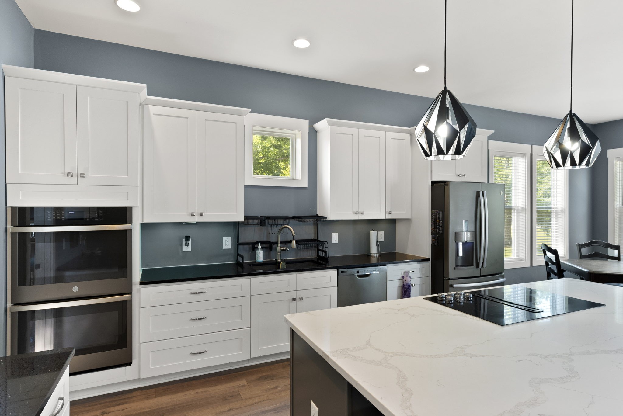 4217 Sandy Springs Road Springfield, TN 37172 - Photo 24 of 50 a kitchen with stainless steel appliances kitchen island granite countertop a sink a stove and cabinets