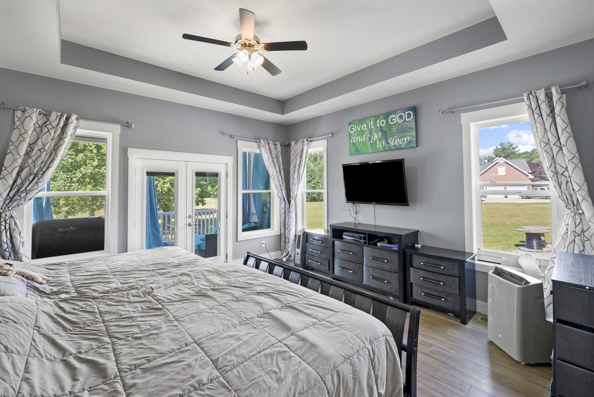 4217 Sandy Springs Road Springfield, TN 37172 - Photo 27 of 50 a bedroom with a bed and a flat screen tv