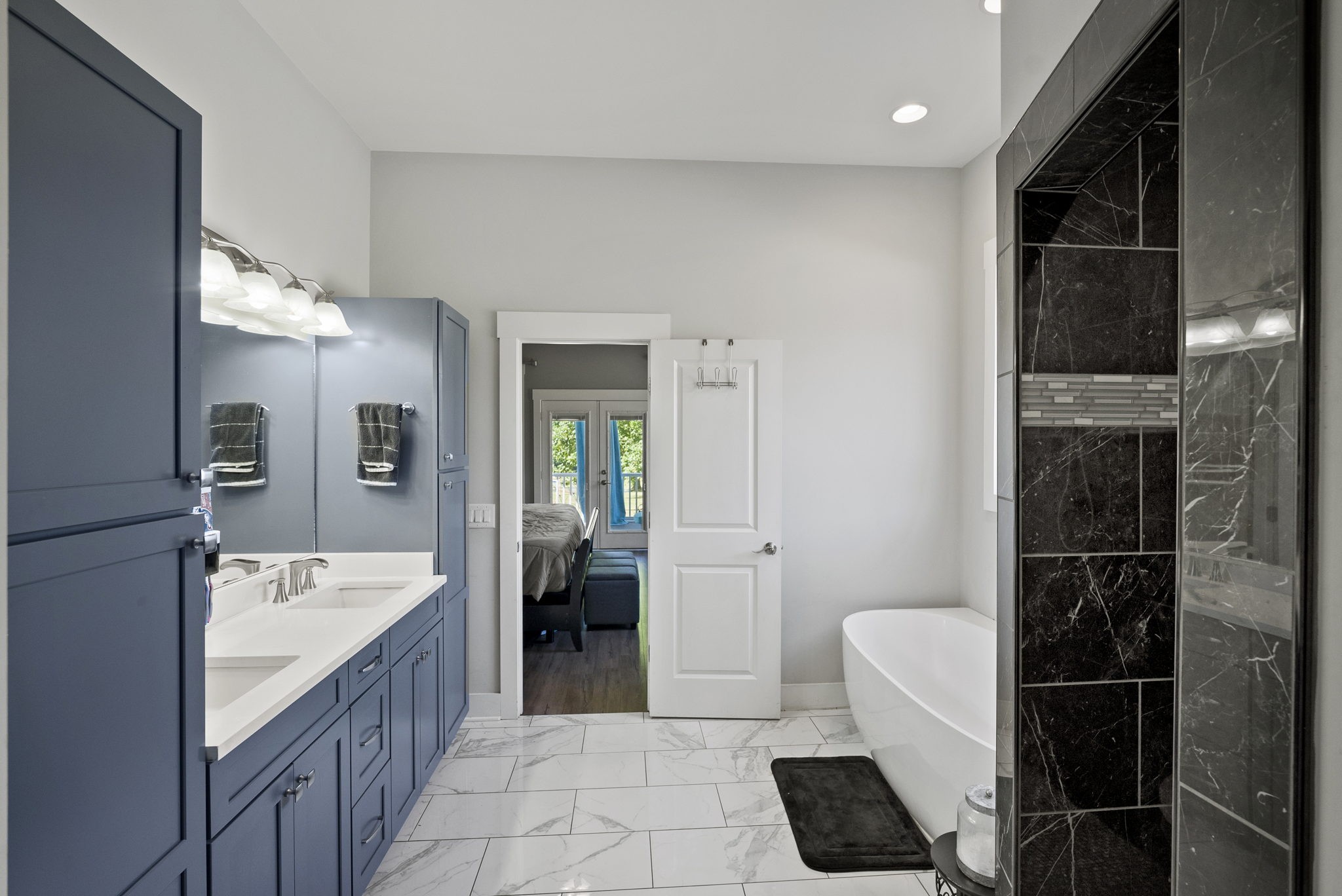 4217 Sandy Springs Road Springfield, TN 37172 - Photo 29 of 50 a bathroom with a double vanity sink a toilet and shower