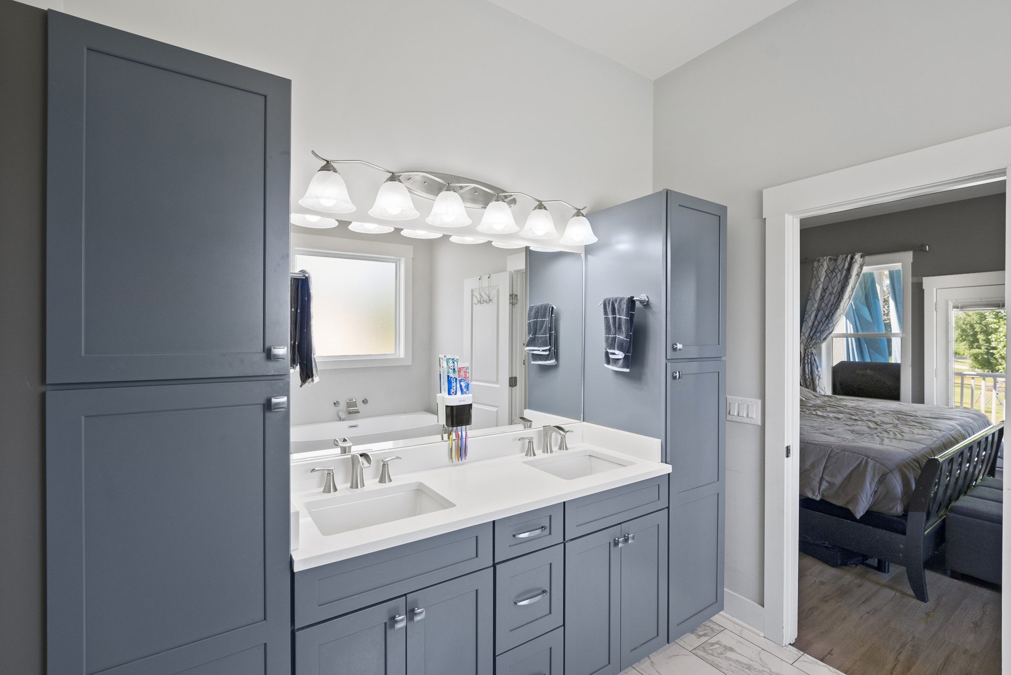 4217 Sandy Springs Road Springfield, TN 37172 - Photo 30 of 50 a en suite bathroom with a double vanity sink and a mirror