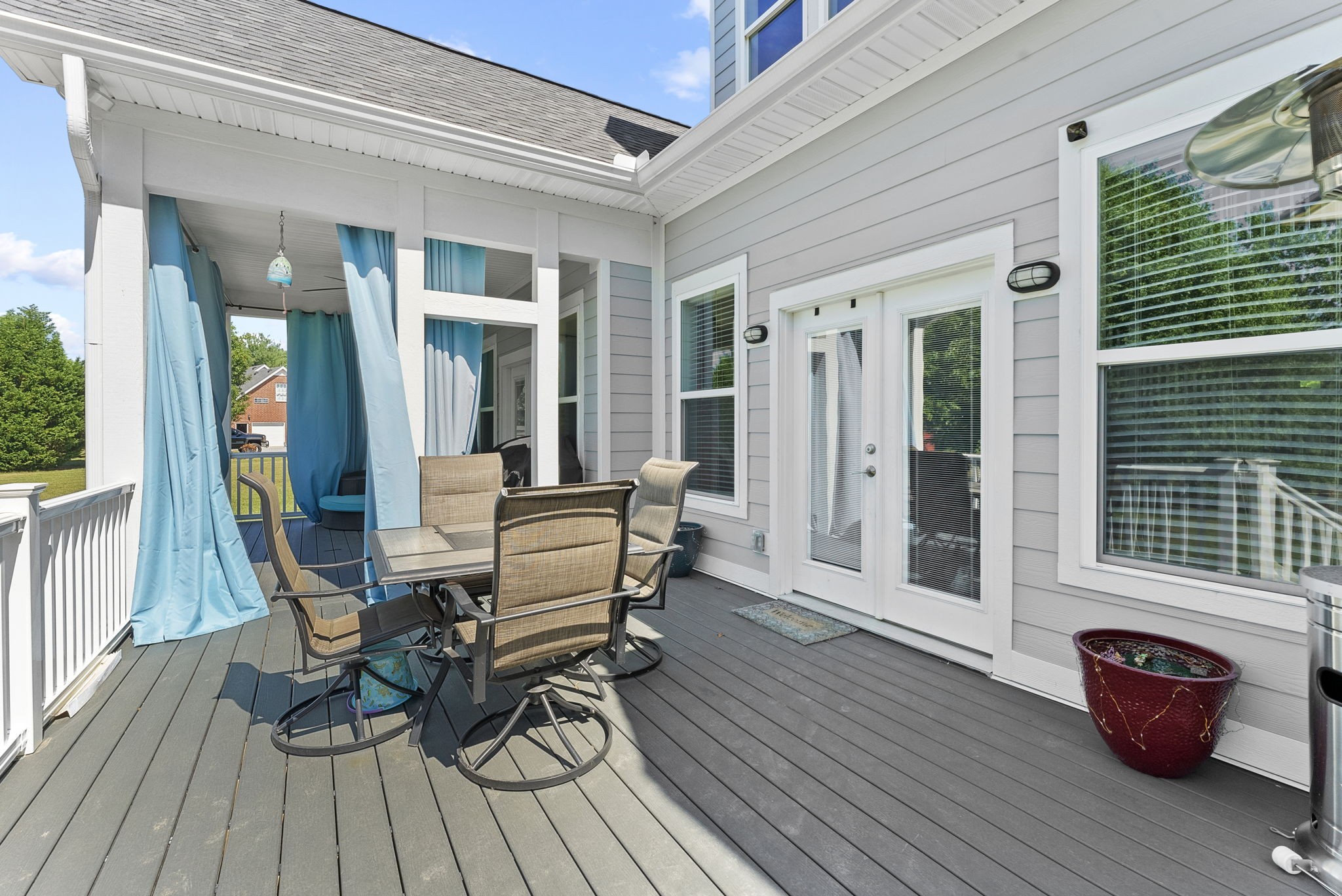 4217 Sandy Springs Road Springfield, TN 37172 - Photo 45 of 50 a view of a deck with table and chairs and wooden floor
