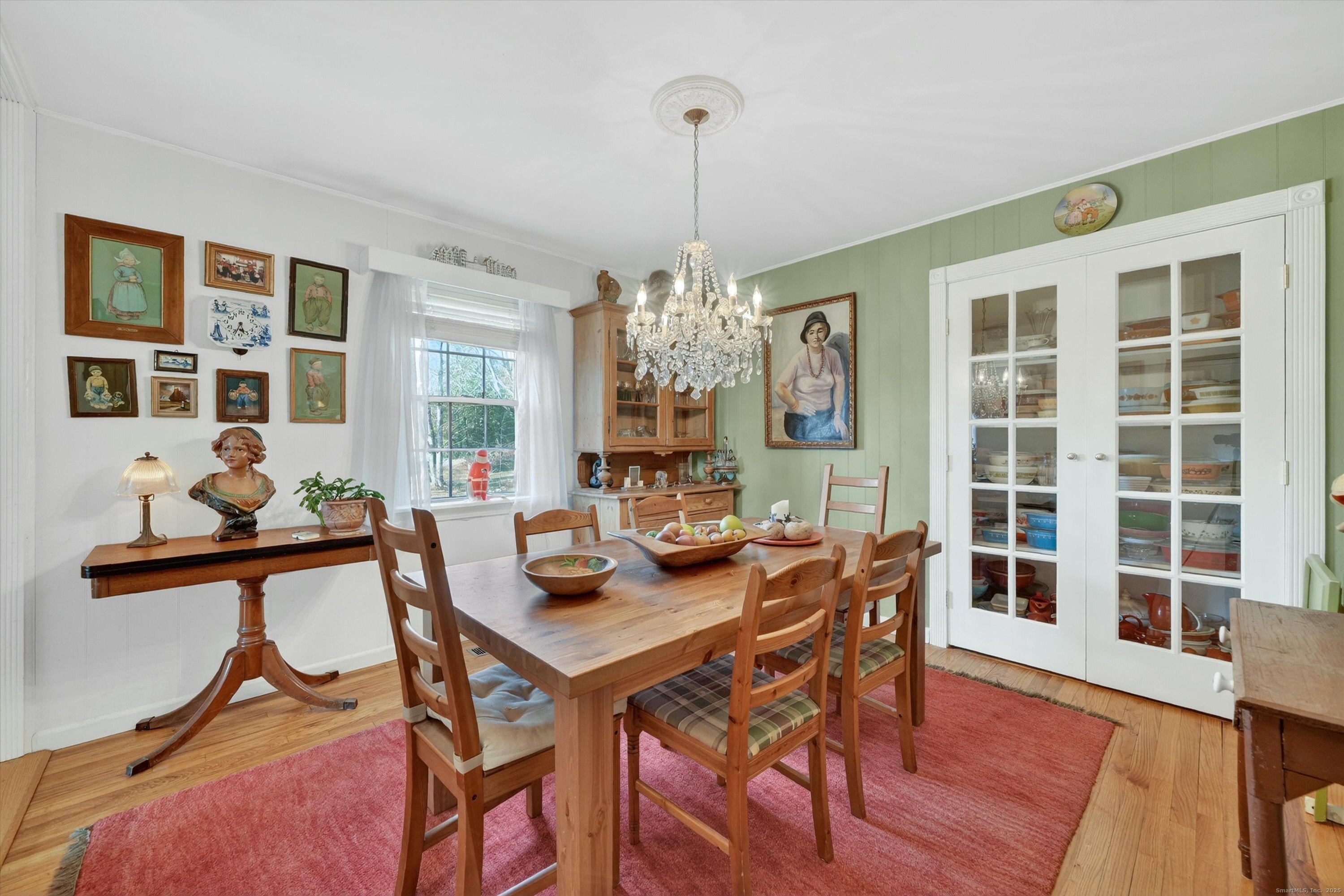 246 Romanock Road Fairfield, CT 06825 - Photo 11 of 37 a view of a dining room with furniture window and wooden floor