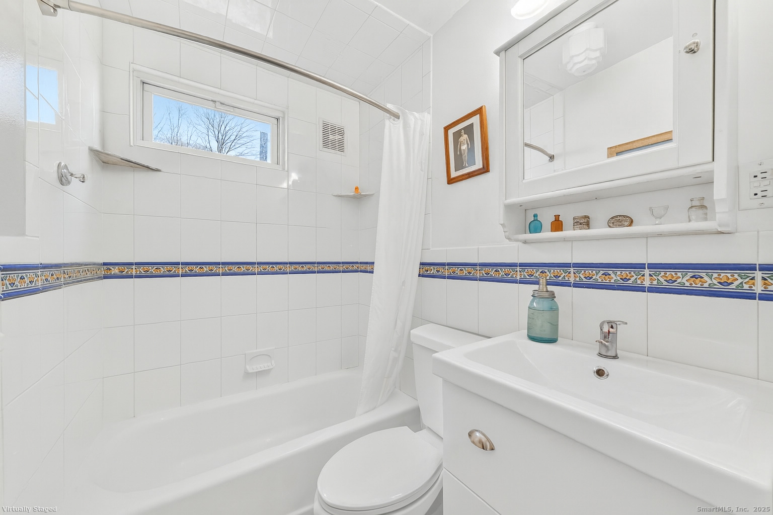 246 Romanock Road Fairfield, CT 06825 - Photo 14 of 37 a bathroom with a sink and a bathtub