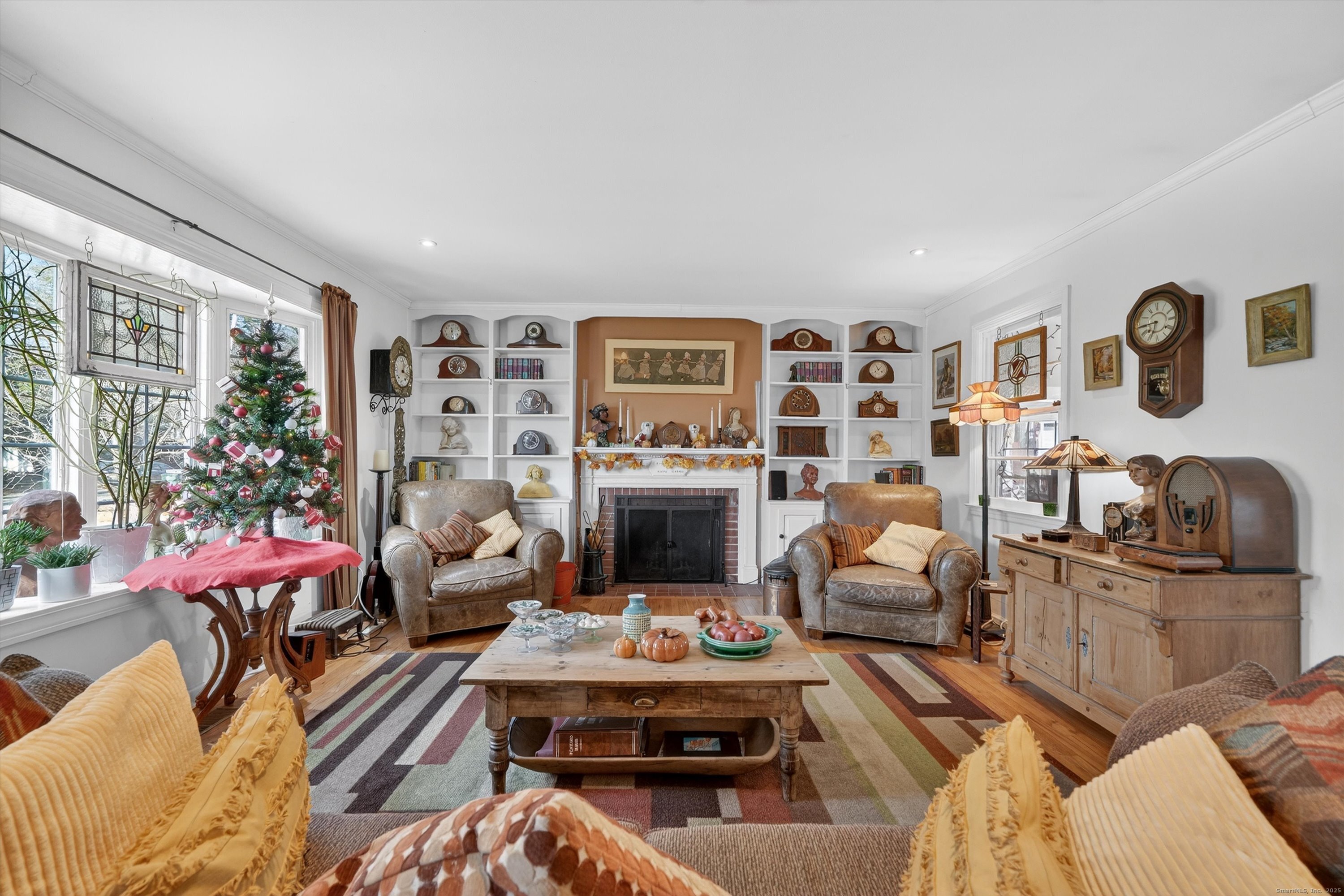 246 Romanock Road Fairfield, CT 06825 - Photo 16 of 37 a living room with furniture fireplace and rug