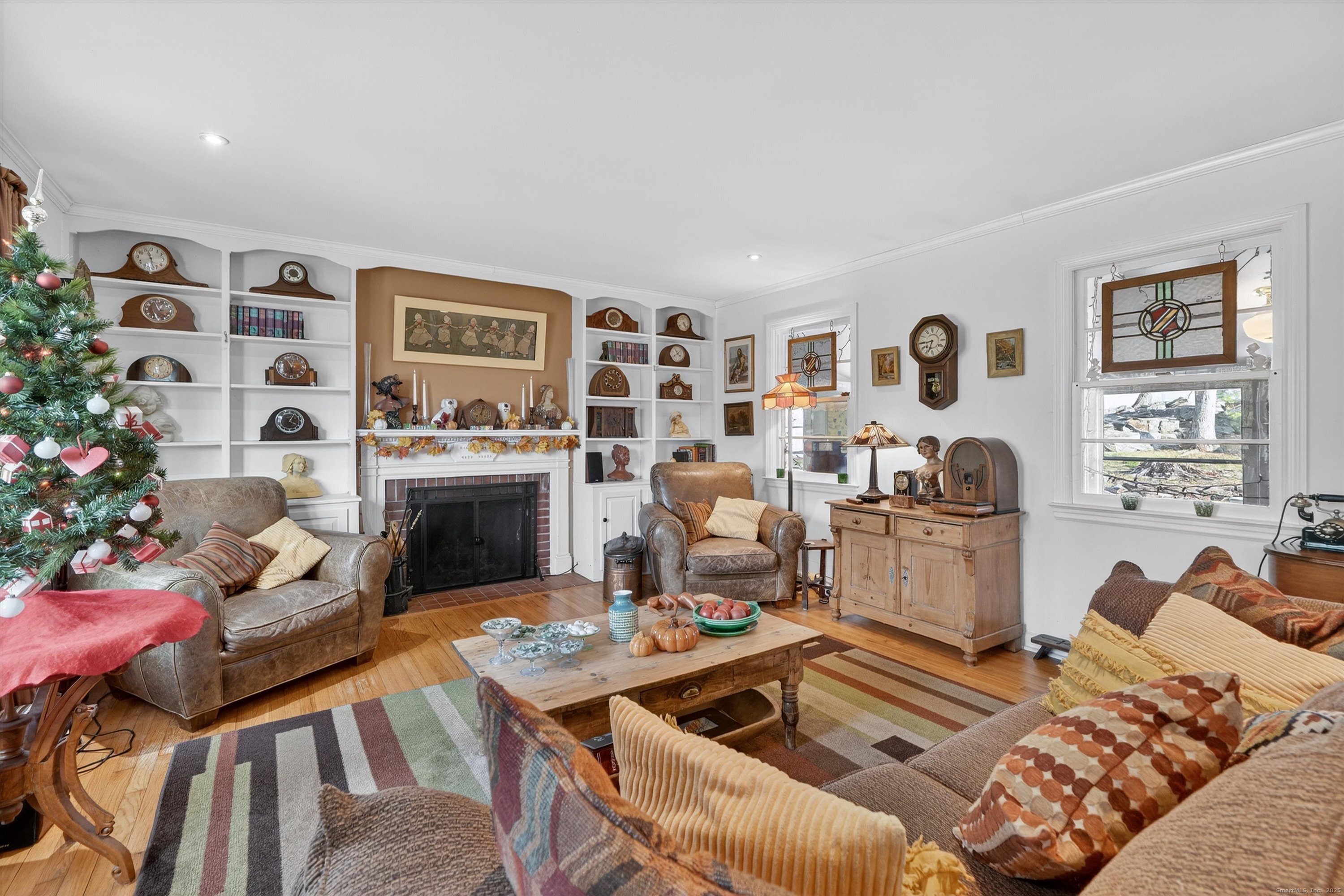 246 Romanock Road Fairfield, CT 06825 - Photo 17 of 37 a living room with furniture and a fireplace