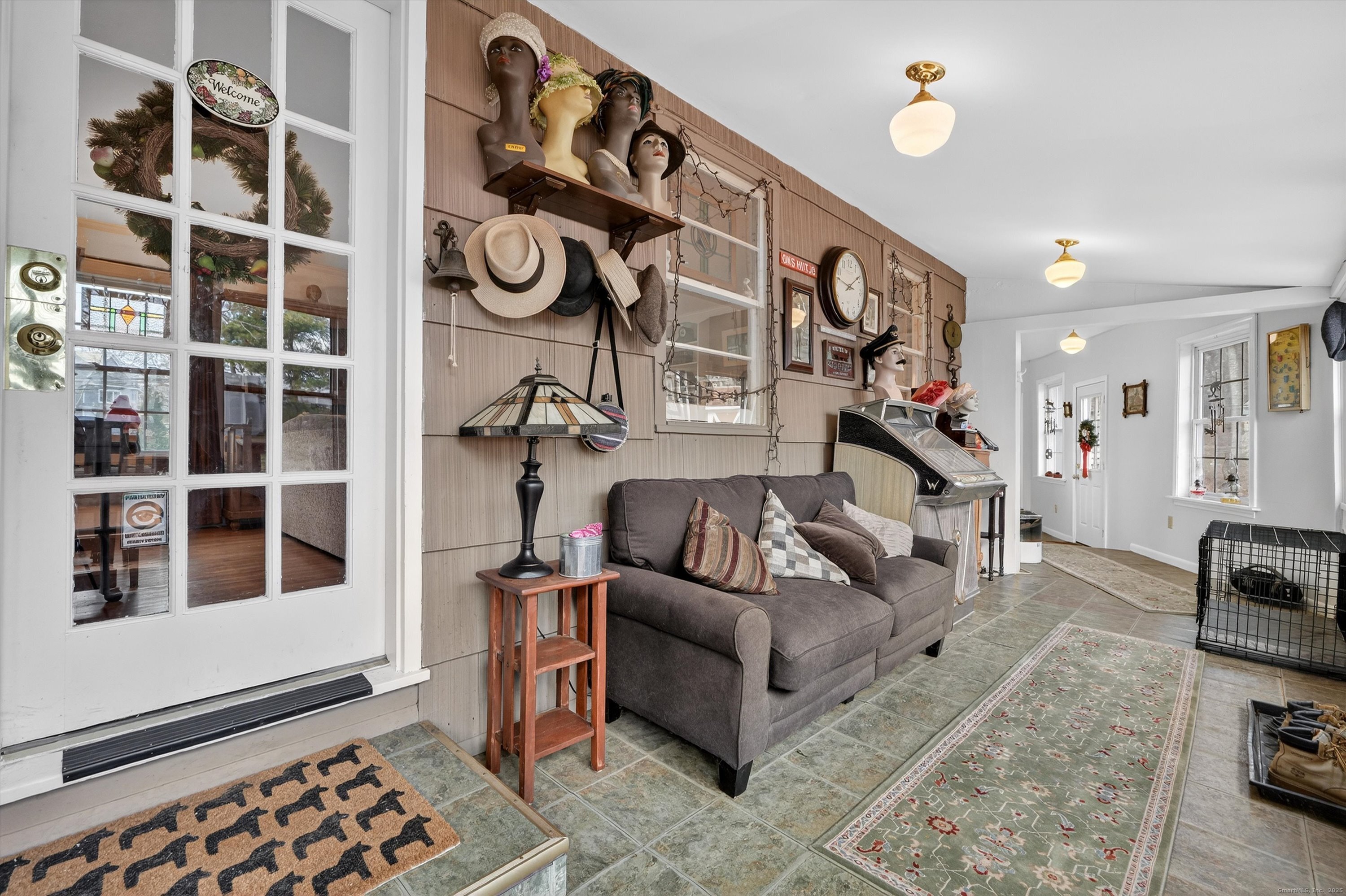 246 Romanock Road Fairfield, CT 06825 - Photo 19 of 37 a living room with furniture cabinets and a window