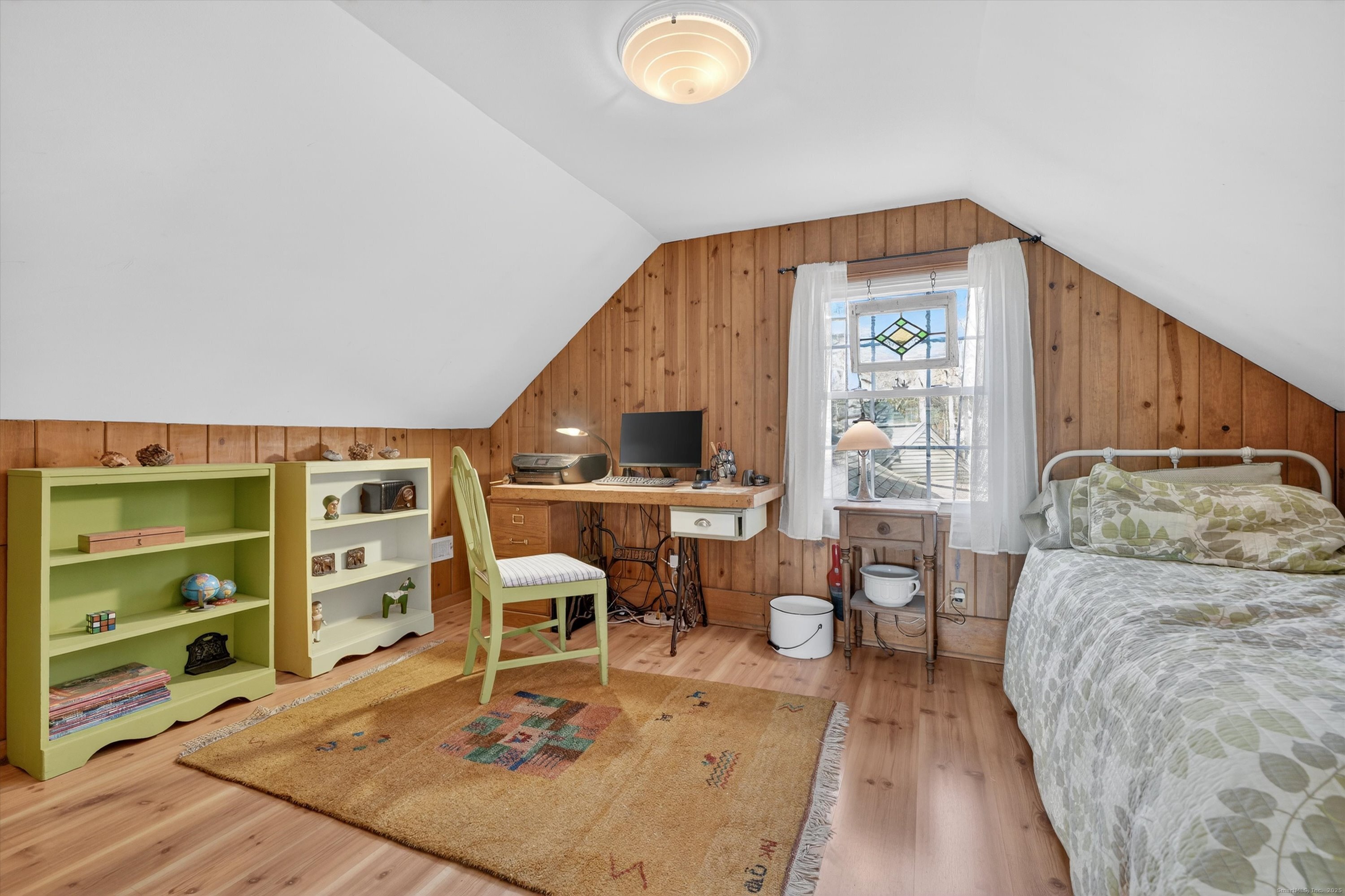 246 Romanock Road Fairfield, CT 06825 - Photo 21 of 37 a living room with furniture and a flat screen tv