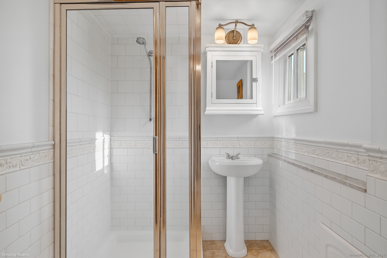 246 Romanock Road Fairfield, CT 06825 - Photo 24 of 37 a bathroom with a sink and a mirror