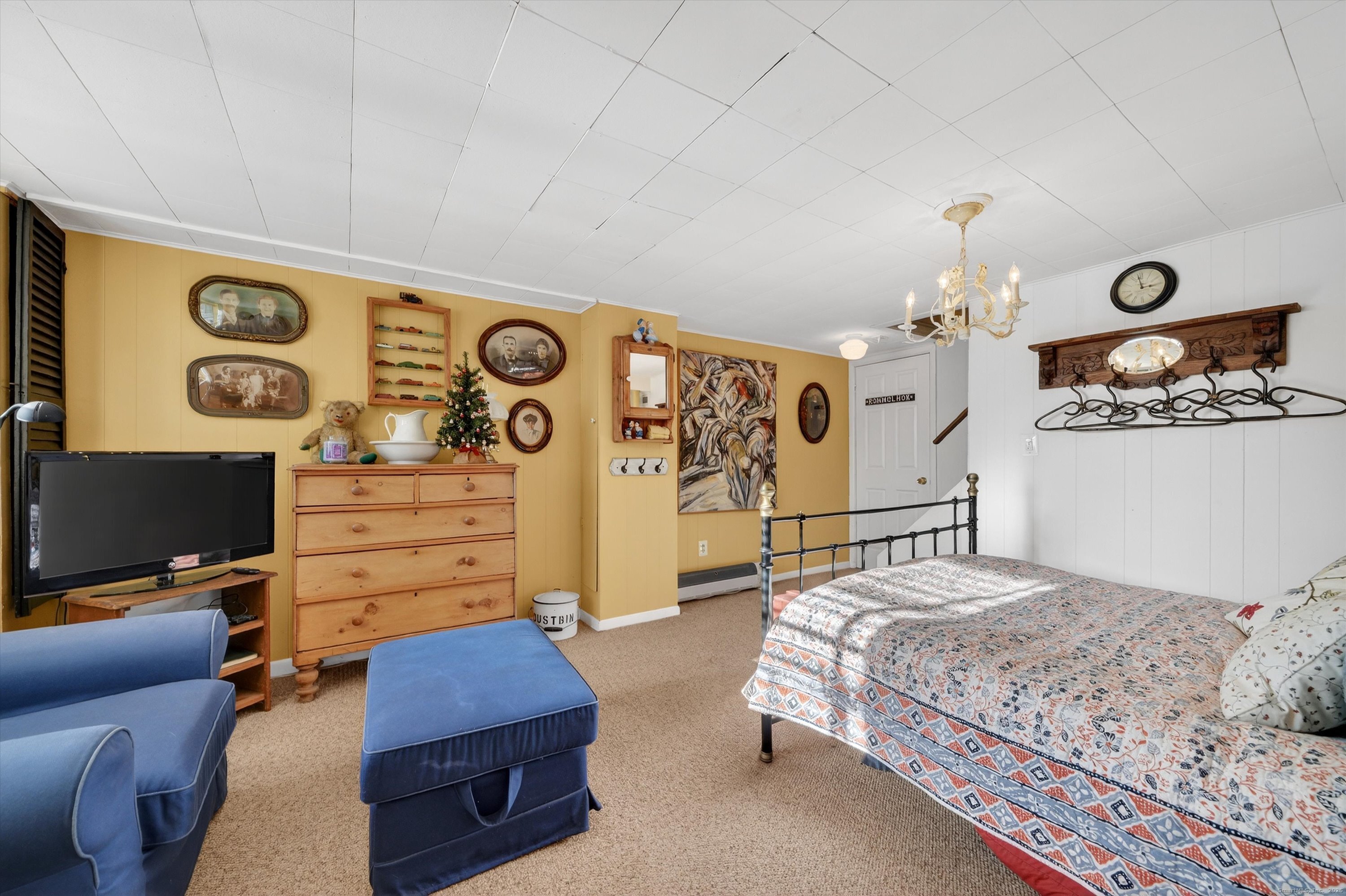 246 Romanock Road Fairfield, CT 06825 - Photo 26 of 37 a bedroom with a bed and ceiling fan