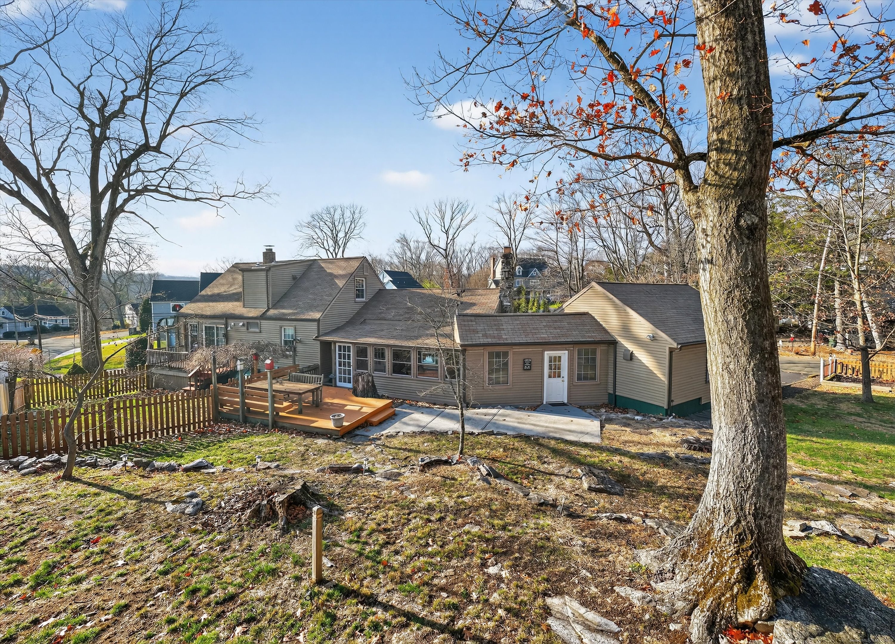 246 Romanock Road Fairfield, CT 06825 - Photo 31 of 37 a front view of a house with a yard covered with snow