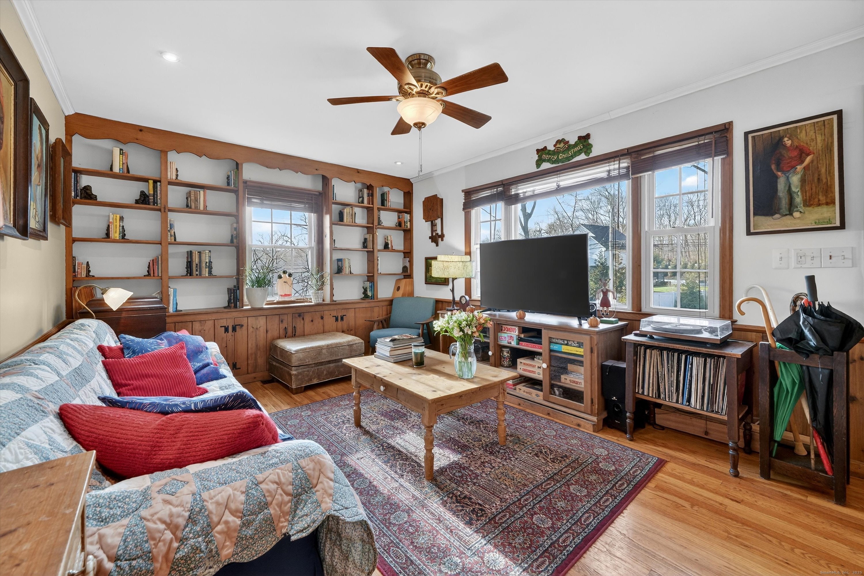 246 Romanock Road Fairfield, CT 06825 - Photo 5 of 37 a living room with furniture and a flat screen tv