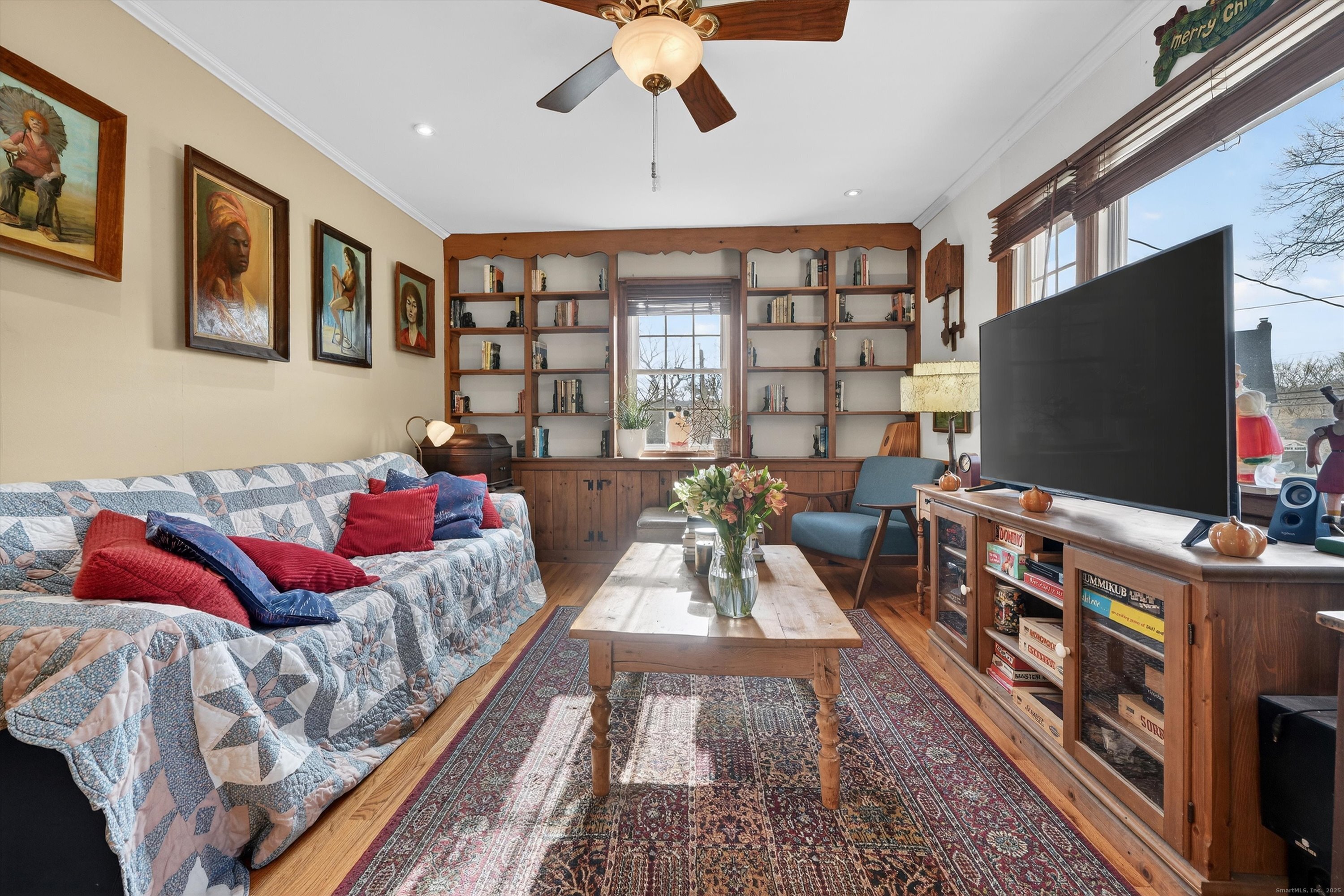 246 Romanock Road Fairfield, CT 06825 - Photo 6 of 37 a living room with furniture and a flat screen tv