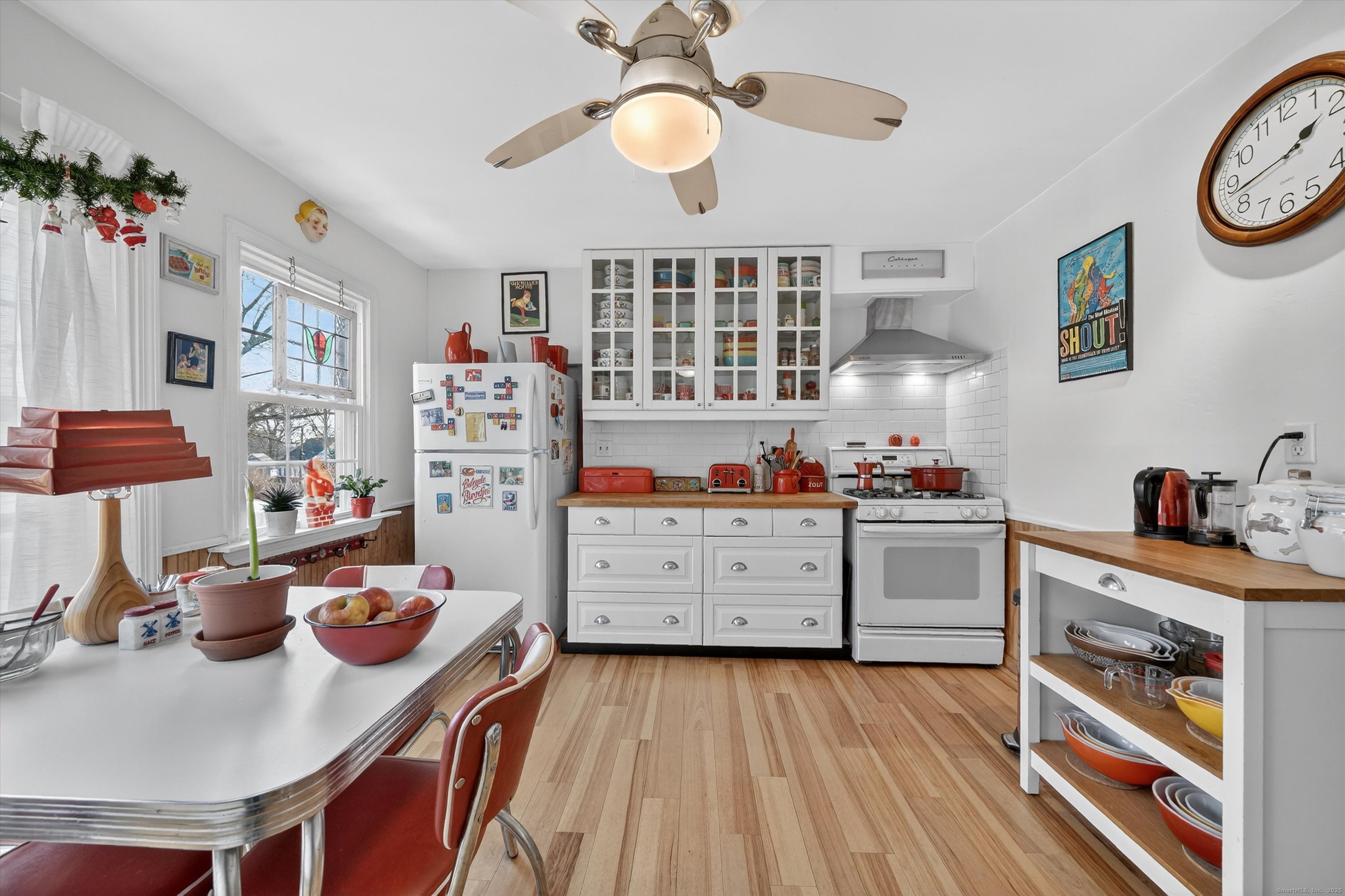 246 Romanock Road Fairfield, CT 06825 - Photo 10 of 37 a kitchen with stainless steel appliances a stove a window and cabinets