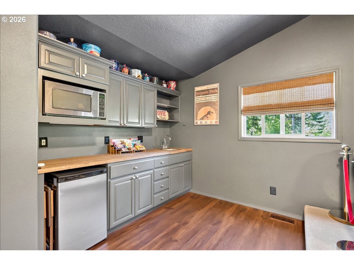 28311 Northwest Nowakowski Road Buxton, OR 97109 - Photo 31 of 48 a kitchen with granite countertop a sink cabinets stainless steel appliances and a window