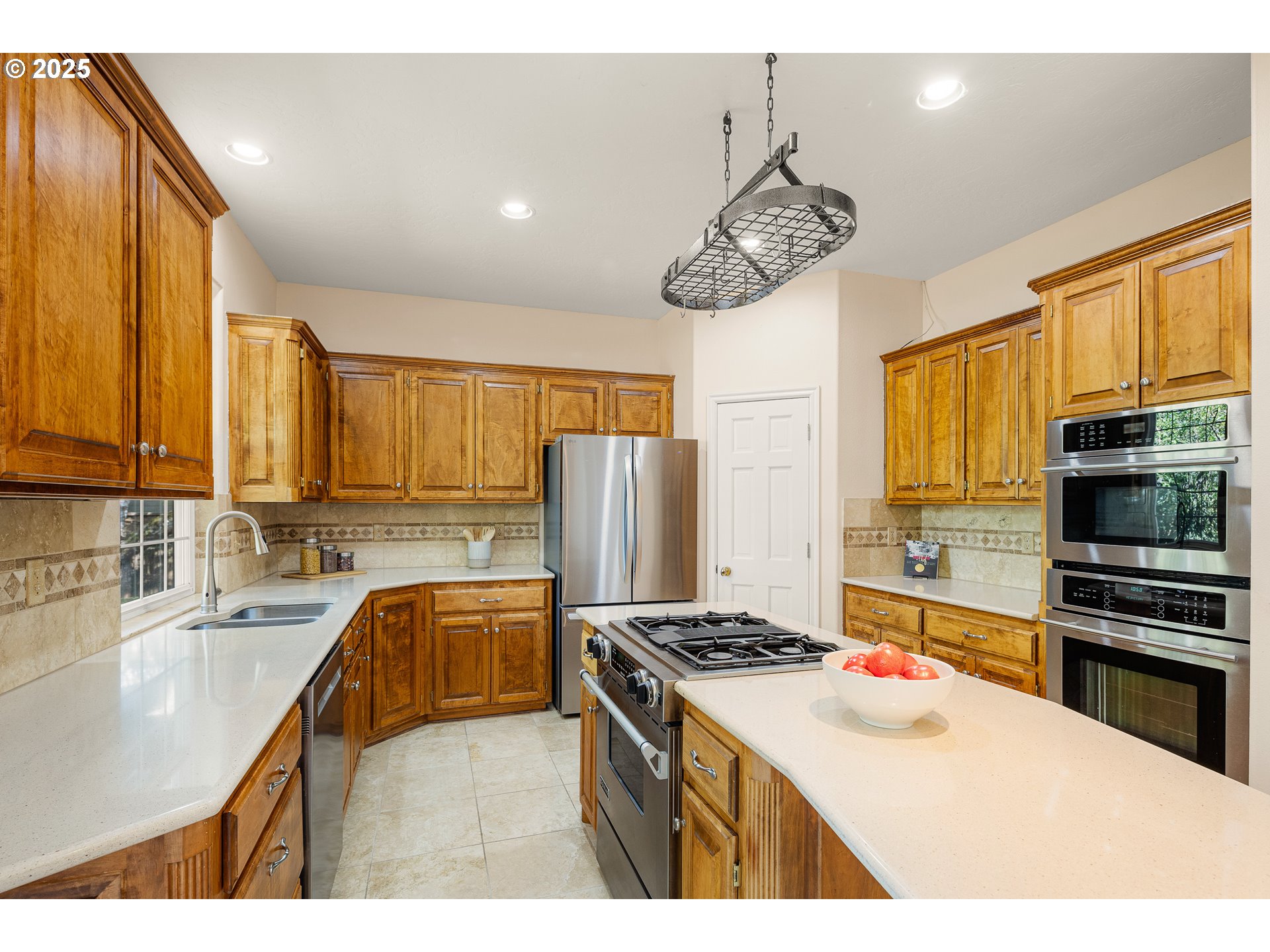 1468 Wimbledon Place Springfield, OR 97477 - Photo 11 of 47 a kitchen with a refrigerator a stove a sink and a microwave