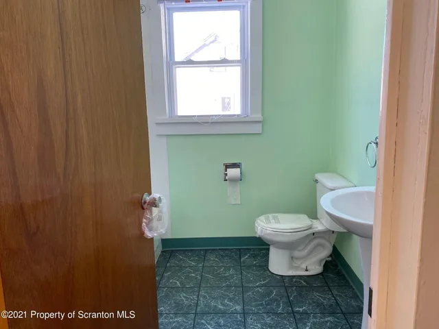 a bathroom with a toilet